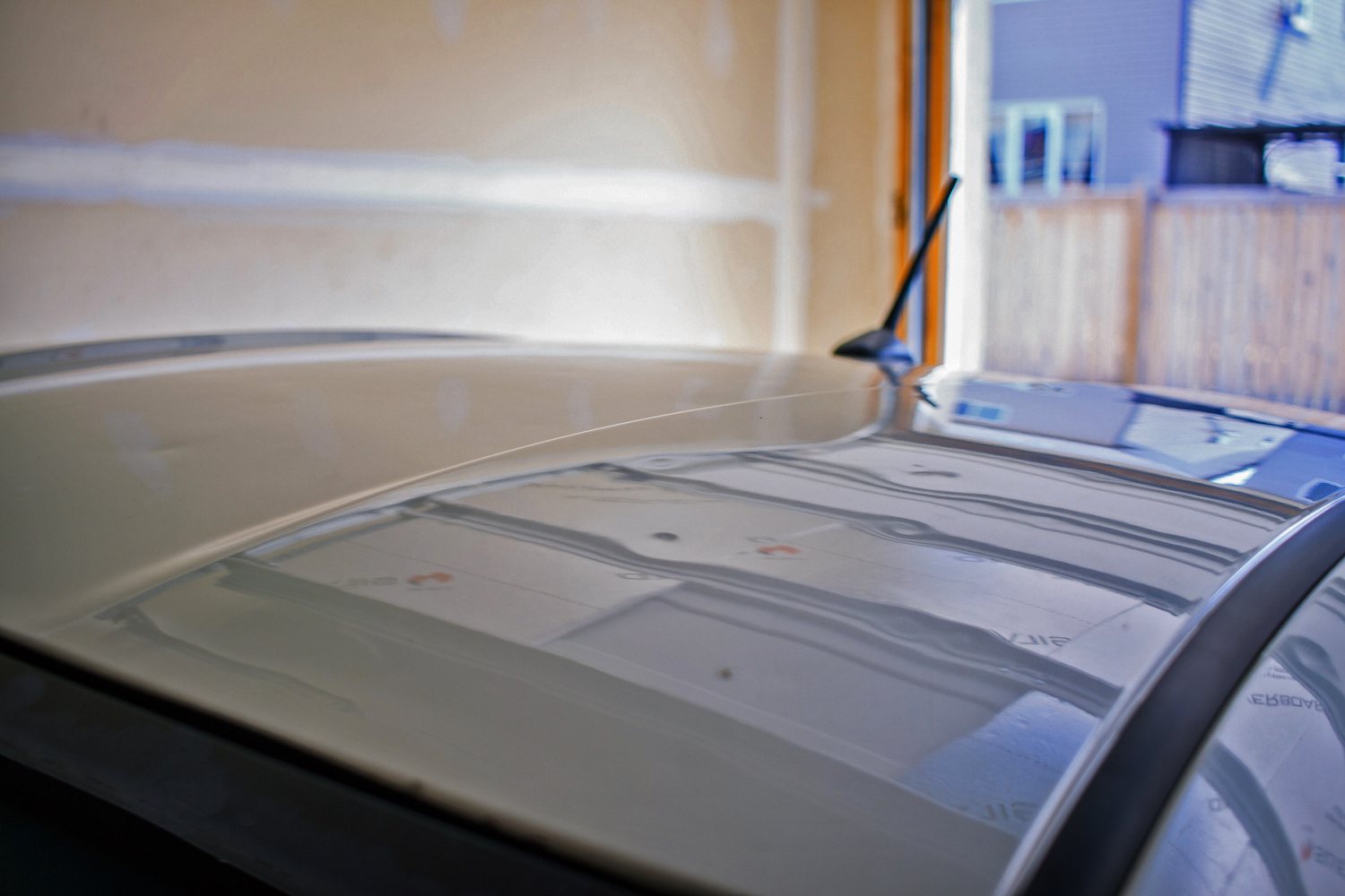 Vehicle roof with multiple documented hail dents before paintless dent repair.